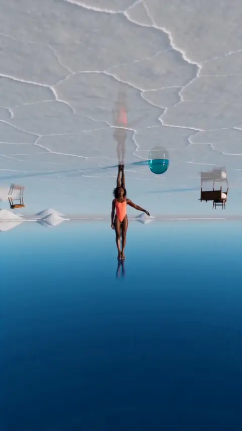 A swimmer stands on a mirrored waterline under an inverted salt sky as titles read depth has no direction